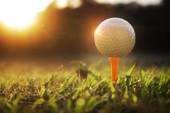 Golf balls on tee in beautiful golf courses with sun rise background royalty free stock image Golf balls on tee in beautiful golf courses with sun rise background royalty free stock image