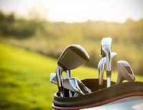 Golf Clubs Drivers Over Green Field Background Royalty Free Stock Photo