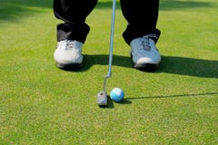Golfer putting the earth royalty free stock images Golfer putting the earth royalty free stock images