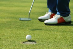 Golfer putting golf ball on the green golf royalty free stock photography Golfer putting golf ball on the green golf royalty free stock photography
