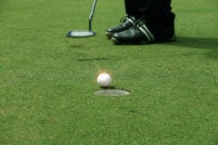 Golfer putting golf ball on the green golf royalty free stock image Golfer putting golf ball on the green golf royalty free stock image