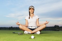 Golfer Sitting In Yoga Posture On Golf Course. Royalty Free Stock Photography