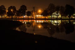 Gorgeous night landscape over the lake. Light reflected in the water. royalty free stock image Gorgeous night landscape over the lake. Light reflected in the water. royalty free stock image