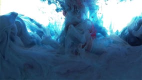 Gota da tinta da cor Propagação da cor Azul e vermelho filme Gota da tinta da cor Propagação da cor Azul e vermelho filme