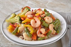 Gourmet shrimp stir fry on quinoa and rice stock image Gourmet shrimp stir fry on quinoa and rice stock image