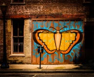 Grafittis da borboleta na cidade ilustração royalty free Grafittis da borboleta na cidade ilustração royalty free