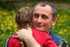 Grandfather hugging granddaughter royalty free stock photography Grandfather hugging granddaughter royalty free stock photography