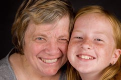 Grandmother And Granddaughter Smiling Stock Images