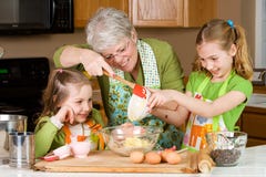 Grandmother baking cookies with children. royalty free stock photography Grandmother baking cookies with children. royalty free stock photography