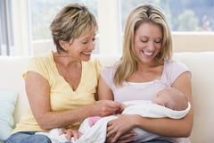Grandmother and mother in living room with baby