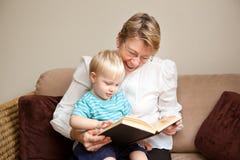 Grandmother Or Nanny Reading To A Child Stock Photography Grandmother Or Nanny Reading To A Child Stock Photography