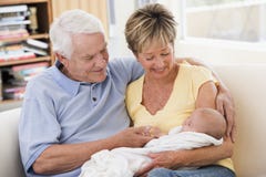 Grandparents in living room with baby royalty free stock images Grandparents in living room with baby royalty free stock images