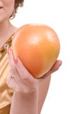 Grapefruit in a female hand royalty free stock photography Grapefruit in a female hand royalty free stock photography