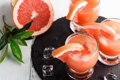 Grapefruit juice and ripe grapefruits stock images Grapefruit juice and ripe grapefruits stock images