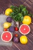 Grapefruits, pears, lemons, figs, strawberry, pomelo, mint on wooden background; still life with fruits Royalty Free Stock Photo Grapefruits, pears, lemons, figs, strawberry, pomelo, mint on wooden background; still life with fruits Royalty Free Stock Photo