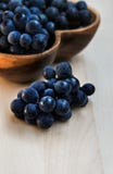 Grapes in a heart shape wooden plate stock images Grapes in a heart shape wooden plate stock images
