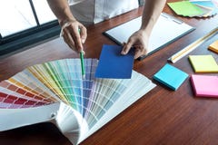 Graphic designer choose colors from the color bands samples for design .Designer graphic creativity working concept royalty free stock photography Graphic designer choose colors from the color bands samples for design .Designer graphic creativity working concept royalty free stock photography