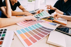 Graphic designers working with color samples stock photo Graphic designers working with color samples stock photo