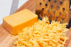 Grated Cheddar Cheese On Wooden Board Stock Photography Grated Cheddar Cheese On Wooden Board Stock Photography