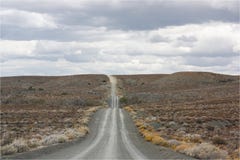 Grava/camino de tierra en la distancia imágenes de archivo libres de regalías Grava/camino de tierra en la distancia imágenes de archivo libres de regalías