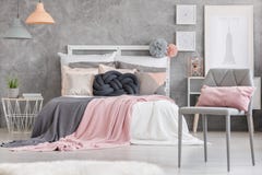 Gray chair with pink pillow stock photography Gray chair with pink pillow stock photography