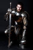 Great Knight Holding His Sword And Helmet Stock Image Great Knight Holding His Sword And Helmet Stock Image