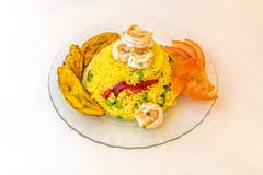 Great Latin American recipe for rice with shrimp, with plantain, rice bowl with coloring and vegetables