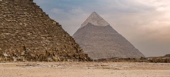 Great pyramid of Khufu and Pyramid of Khafre in far distance with cloudy sky background located at Giza government, Cairo, Egypt Stock Image Great pyramid of Khufu and Pyramid of Khafre in far distance with cloudy sky background located at Giza government, Cairo, Egypt Stock Image