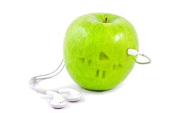 Green Apple With Headphones Royalty Free Stock Photography Green Apple With Headphones Royalty Free Stock Photography