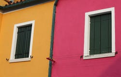 Green balconies of two colored houses in Burano island stock image Green balconies of two colored houses in Burano island stock image