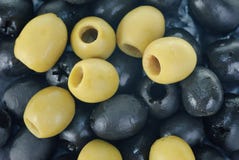 Green and black pitted olives. Abstract background: green and black pitted olives stock photography Green and black pitted olives. Abstract background: green and black pitted olives stock photography