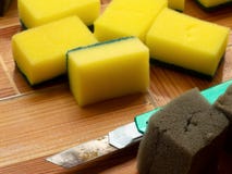 Green cutter cutting Dishwashing sponge into sections royalty free stock photos Green cutter cutting Dishwashing sponge into sections royalty free stock photos
