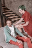 Green-haired woman wearing red dress screaming at her boyfriend royalty free stock image Green-haired woman wearing red dress screaming at her boyfriend royalty free stock image