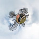 Green little tiny planet with trees near gateway lock sluice construction on river, white clouds and soft blue sky of amusement stock photos Green little tiny planet with trees near gateway lock sluice construction on river, white clouds and soft blue sky of amusement stock photos