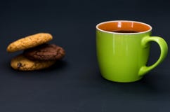 Green orange mug and homemade cookies. royalty free stock images Green orange mug and homemade cookies. royalty free stock images