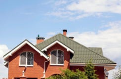 The green roof of the beautiful house with nice window and blue royalty free stock photos The green roof of the beautiful house with nice window and blue royalty free stock photos
