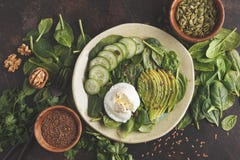 Green Salad With Spinach, Cucumber, Avocado, Egg, Flax And Pumpkin Seed. Food Background. Detox Vegetarian Healthy Food Concept. Royalty Free Stock Images