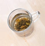 Green tea in glass cup with leafs Stock Photo Green tea in glass cup with leafs Stock Photo