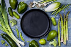 Green veggies group. Vegetarian dinner ingredients. Green vegetables variety. Overhead, flat lay, top view, copy space. stock image Green veggies group. Vegetarian dinner ingredients. Green vegetables variety. Overhead, flat lay, top view, copy space. stock image