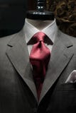Grey jacket with red tie