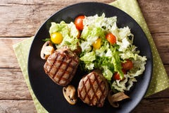 Grilled filet mignon steak with vegetable salad and mushrooms cl royalty free stock images Grilled filet mignon steak with vegetable salad and mushrooms cl royalty free stock images