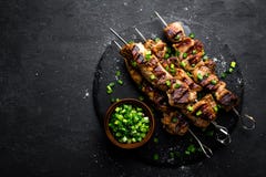 Grilled Meat Skewers, Shish Kebab On Black Background, Top View Royalty Free Stock Photos Grilled Meat Skewers, Shish Kebab On Black Background, Top View Royalty Free Stock Photos