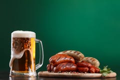 Grilled sausages with glass of beer royalty free stock photos Grilled sausages with glass of beer royalty free stock photos