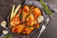 Grilled spicy chicken legs baked with garlic, rosemary and thyme royalty free stock image Grilled spicy chicken legs baked with garlic, rosemary and thyme royalty free stock image
