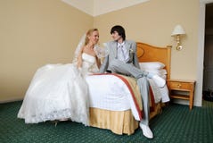 Groom and bride in hotel room Stock Images Groom and bride in hotel room Stock Images