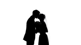 Groom and bride shadow kissing during wedding ceremony, romantic day, engagement stock photo Groom and bride shadow kissing during wedding ceremony, romantic day, engagement stock photo