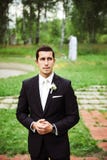 Groom standing in a green area royalty free stock photos Groom standing in a green area royalty free stock photos