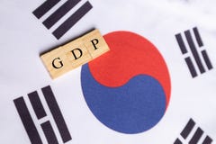 Gross Domestic Product or GDP of South Korea in wooden block letters on South Korean flag