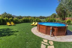 Ground home swimming pool in the garden for the tourists. stock photos Ground home swimming pool in the garden for the tourists. stock photos