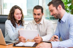Group of business associates working together at the office stock photos Group of business associates working together at the office stock photos